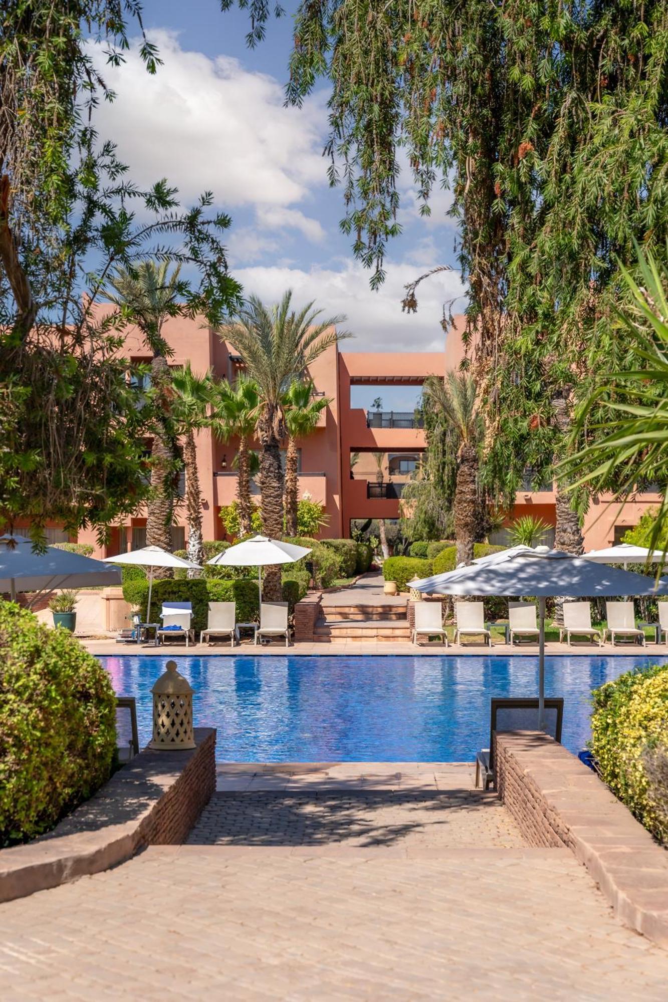 Kenzi Menara Palace & Resort Marrakesh Bagian luar foto The swimming pool at the hotel