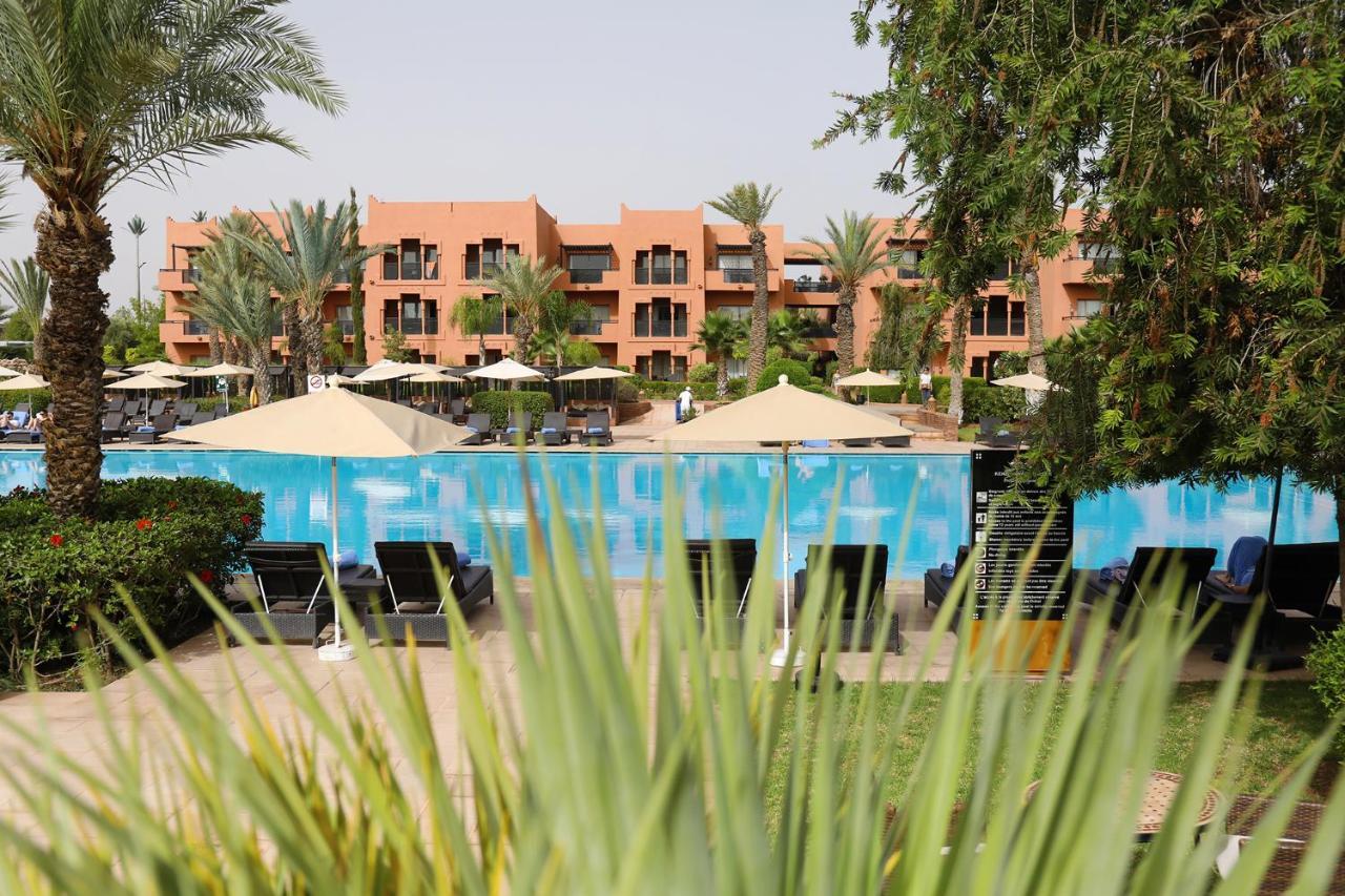 Kenzi Menara Palace & Resort Marrakesh Bagian luar foto The swimming pool at the hotel