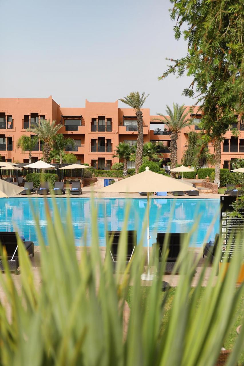 Kenzi Menara Palace & Resort Marrakesh Bagian luar foto The swimming pool at the hotel